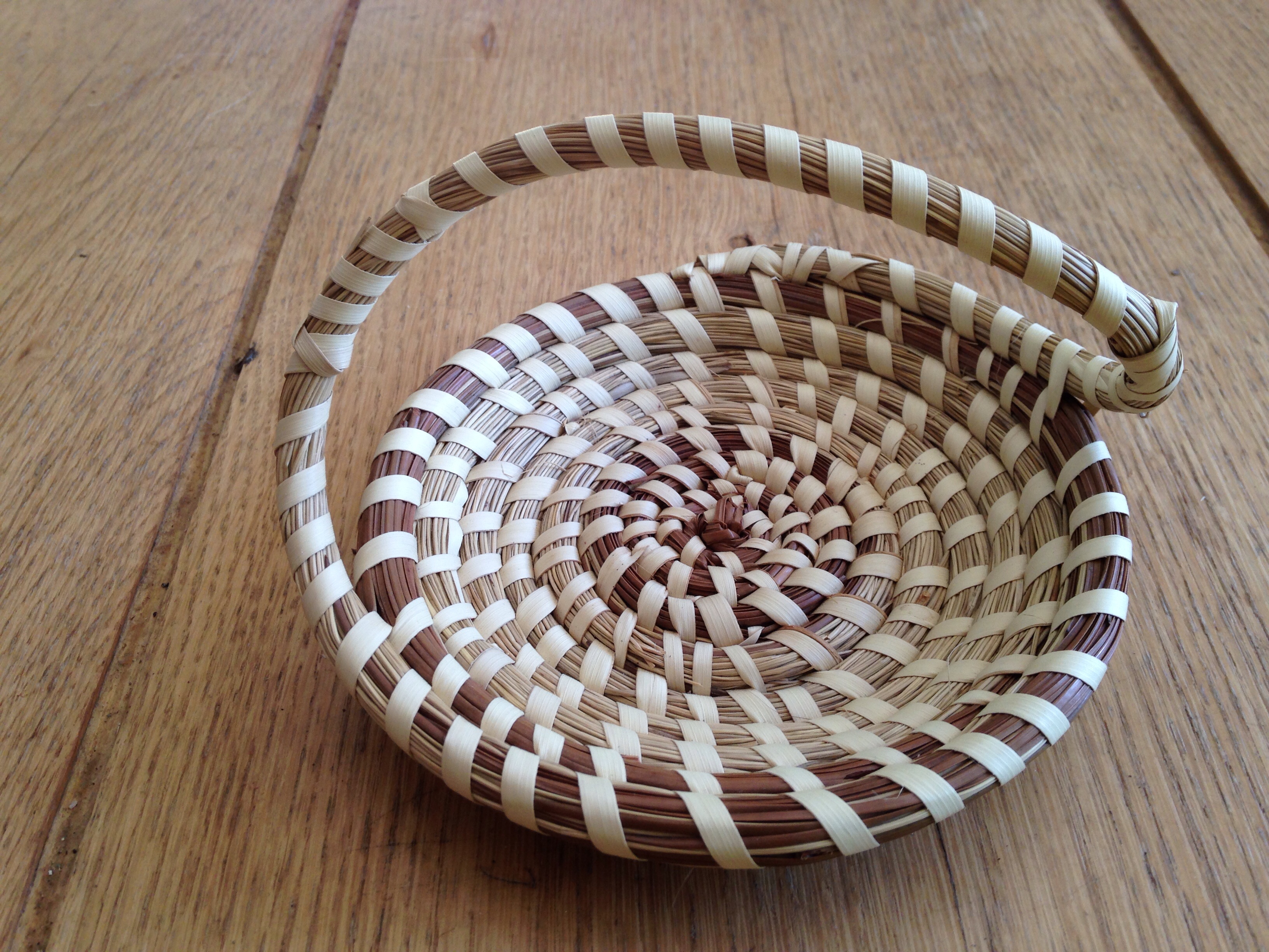 Coiled sweetgrass and pine needle basket from Charleston