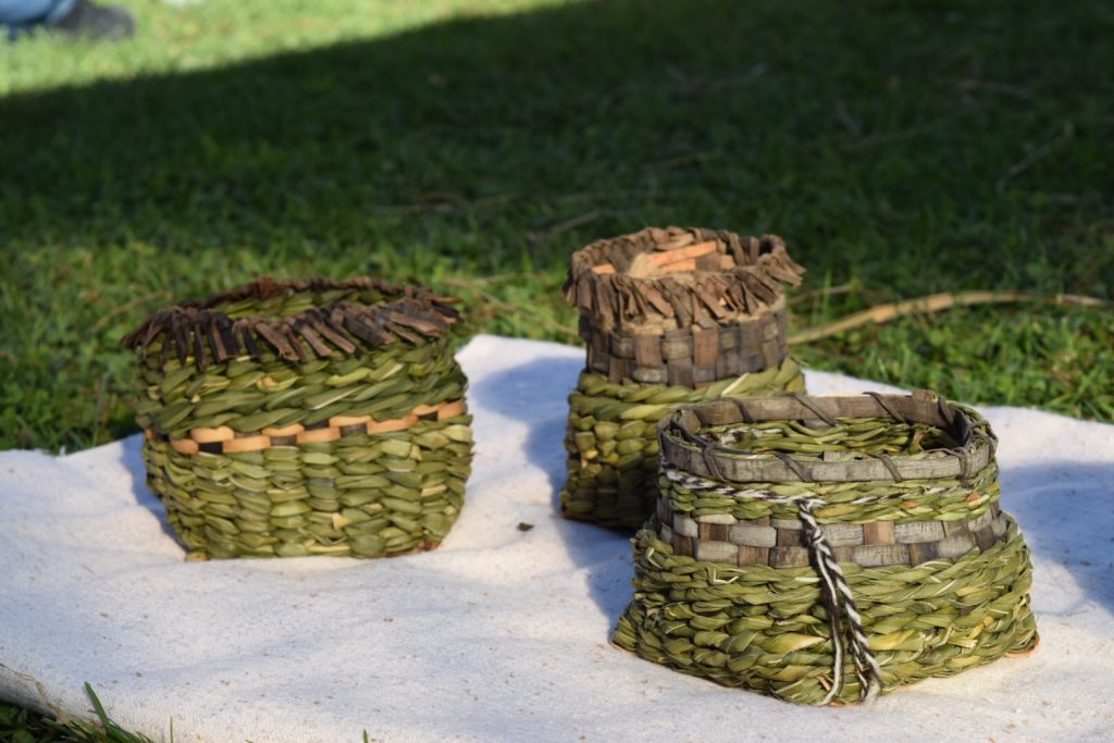 A group of twined cattail, Iris, and black walnut bark baskets